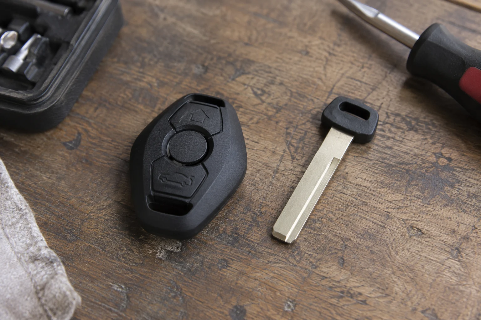A replacement remote housing beside a separate uncut blade.